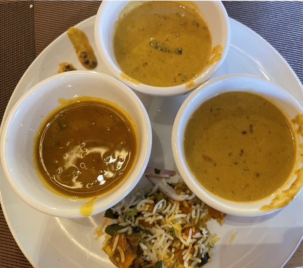 If you're not a professional server, it's hard to hustle a plate full of soupy goodies without some spillage. Bowls of lentil dal padka, veggie korma, and dal makhani were all tasty and spicy, though, with a scoop of veggie rice biryani alongside.