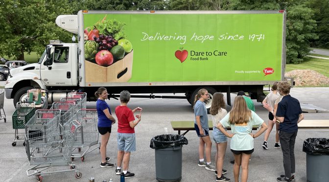 Green as a head of ripe broccoli, Dare To Care Food Bank's truck makes the round of area food pantries with groceries to share with those who need help.