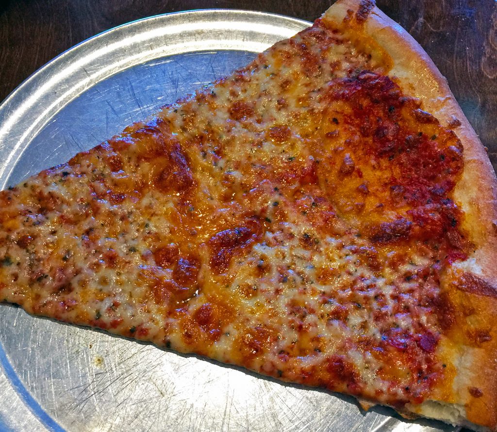 The Post's giant cheese slice is even bigger than the plate it's served on.