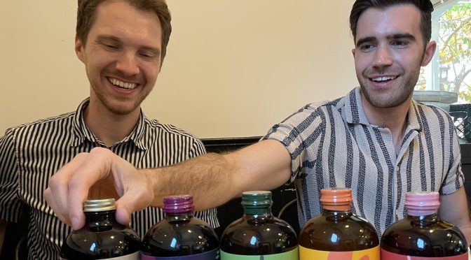 A drink made with Pride: J.D. Mitchell (left) and Eric Wentworth, co-owners of Modica, billed as a 100% certified gay-owned local company that produces M?dica, billed as "the world's first superfood cocktail and mocktail mixer."