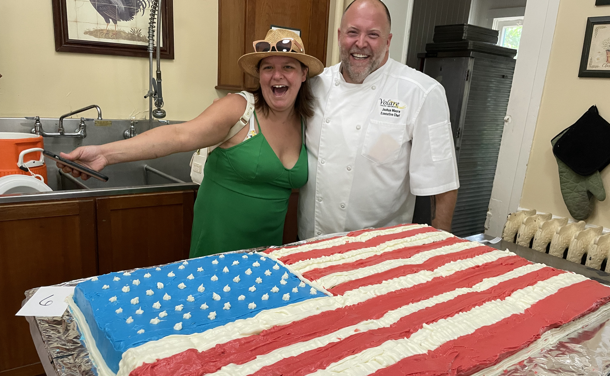 Crescent Hill Old Fashioned Fourth of July Cake Judges Caity DiFabio and Joshua Moore look hungrily at Squish Schmidt's American Flag cake, a giant creation that won the Unicorn award for most patriotic entry.