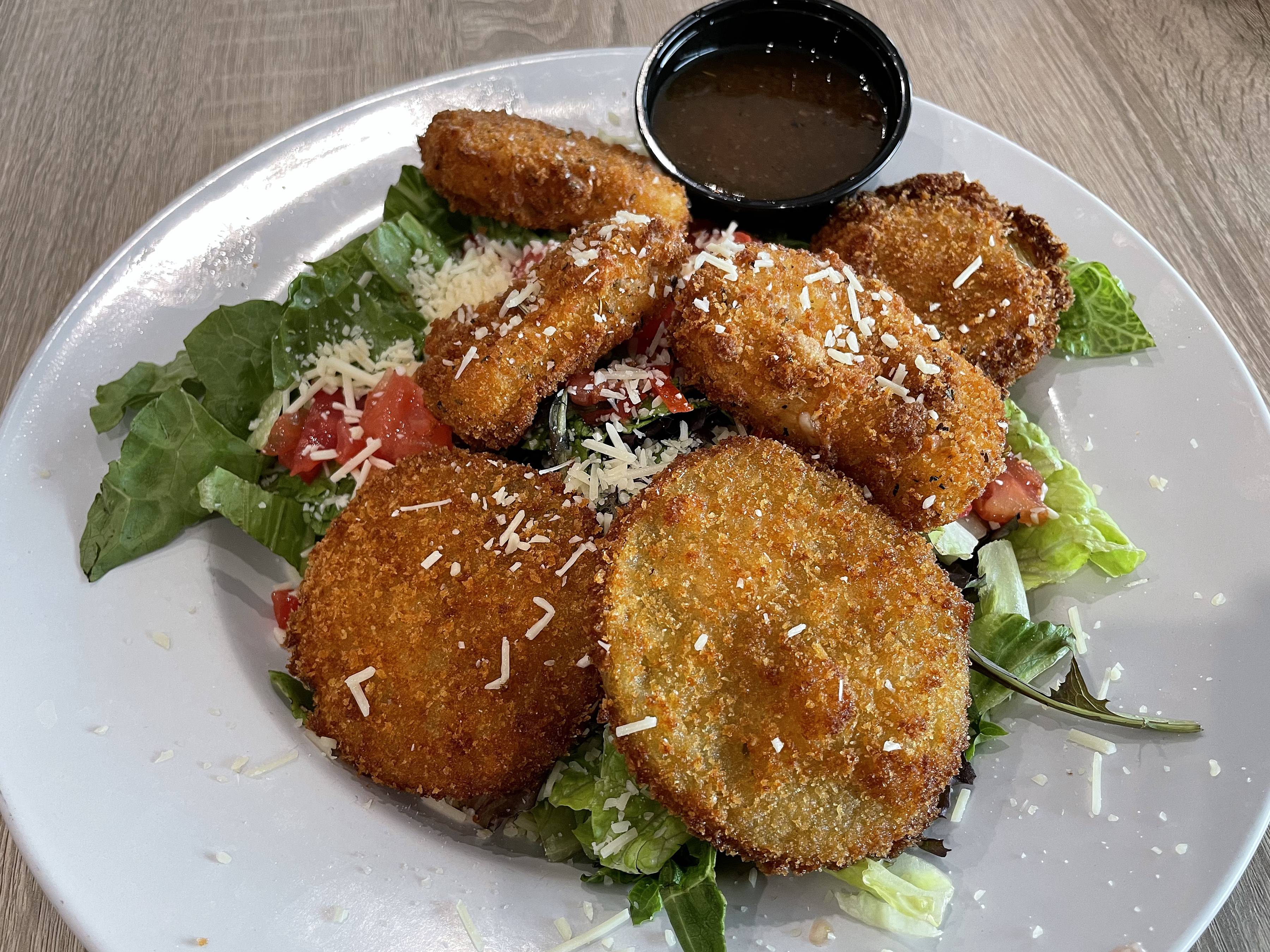 Is a salad still healthy if it's topped with deliciously crusty fried goodies, three each fried mozzarella and fried green tomatoes?