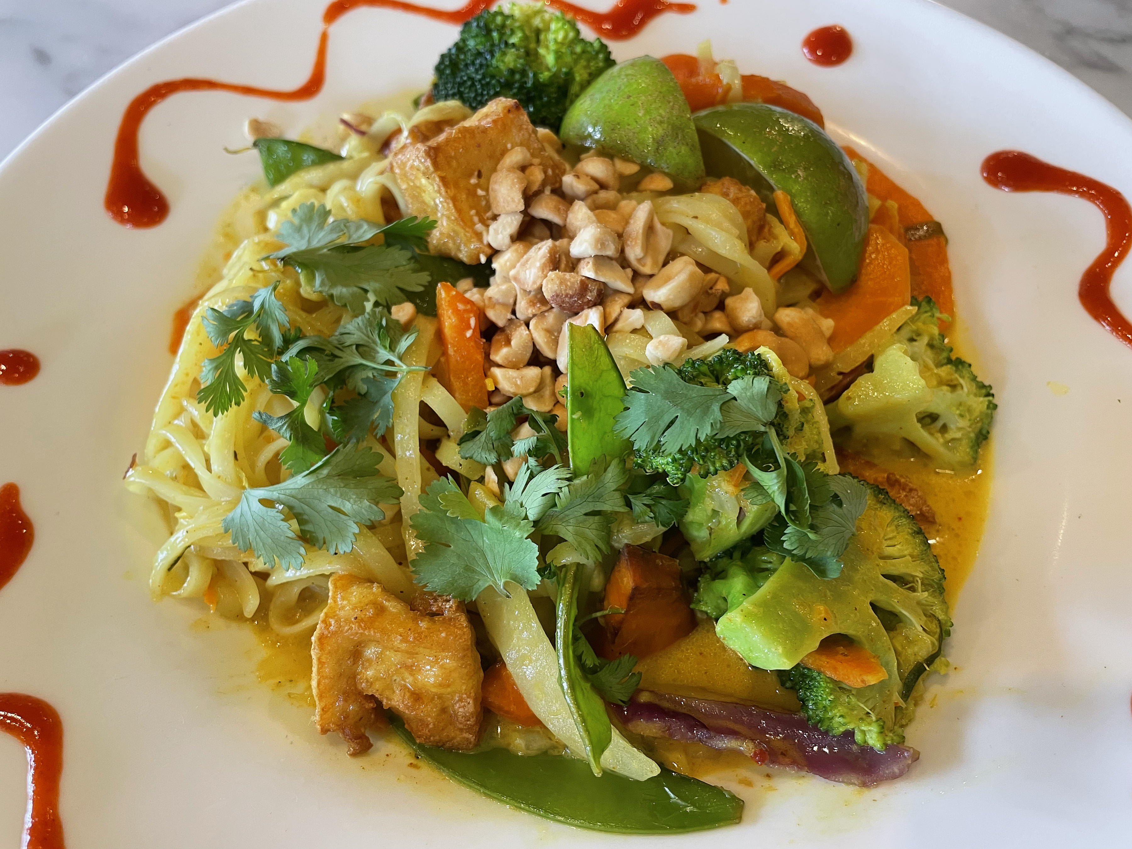 Eat your vegetables and like it: Uptown's gently spicy curried rice noodles are packed with perfectly prepared veggies and tofu.