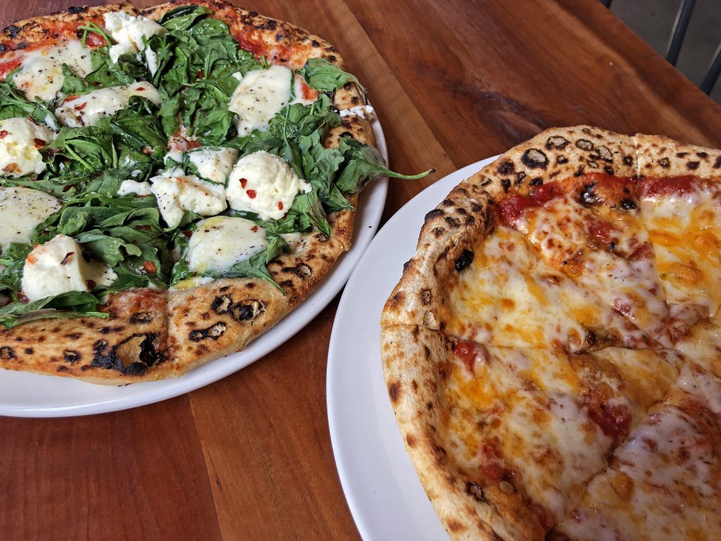 A traditional cheese pizza and a pleasantly spicy spinach and ricotta pie at MozzaPi.