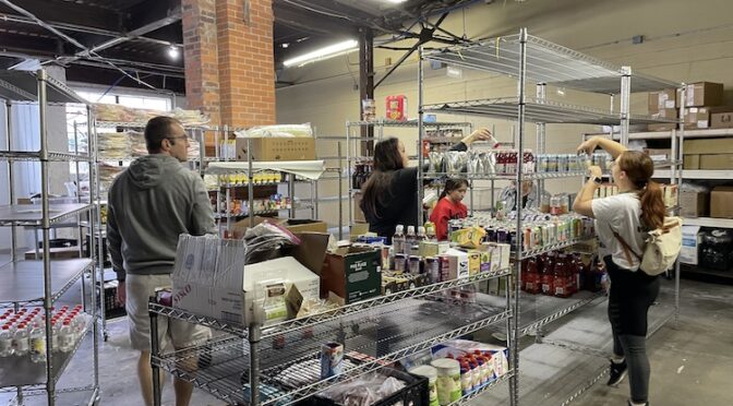 Volunteers get busy in Feed Louisville's food-rescue processing area.