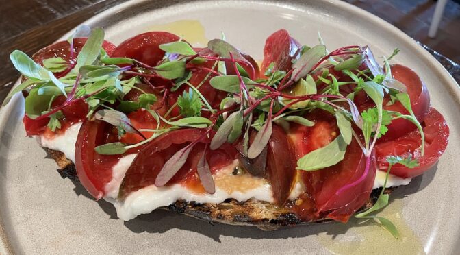 A healthy seasonal summer treat at Barn 8 that didn't overfill us: Heirloom tomato appetizer with seriously garlicky Lebanese toum sauce and house-made sourdough bread.