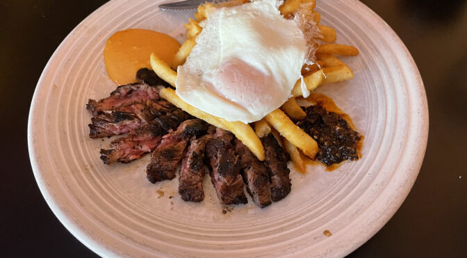 El Mundo's butcher steak gives old-fashioned steak and eggs a warm Mexican flavor that takes them to the next level with a coffee-chile rub, a free-range fried egg, spicy salsas and next-level fries.