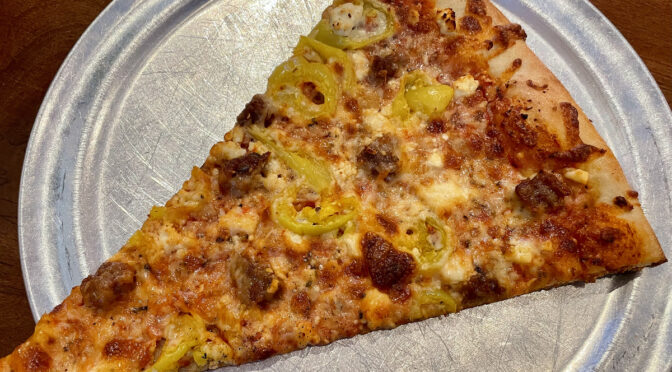 The Post is famous for its oversize, New York City style pizza by the slice, which changes daily. Spicy sausage, banana peppers, and feta cheese did well by this tasty slab.